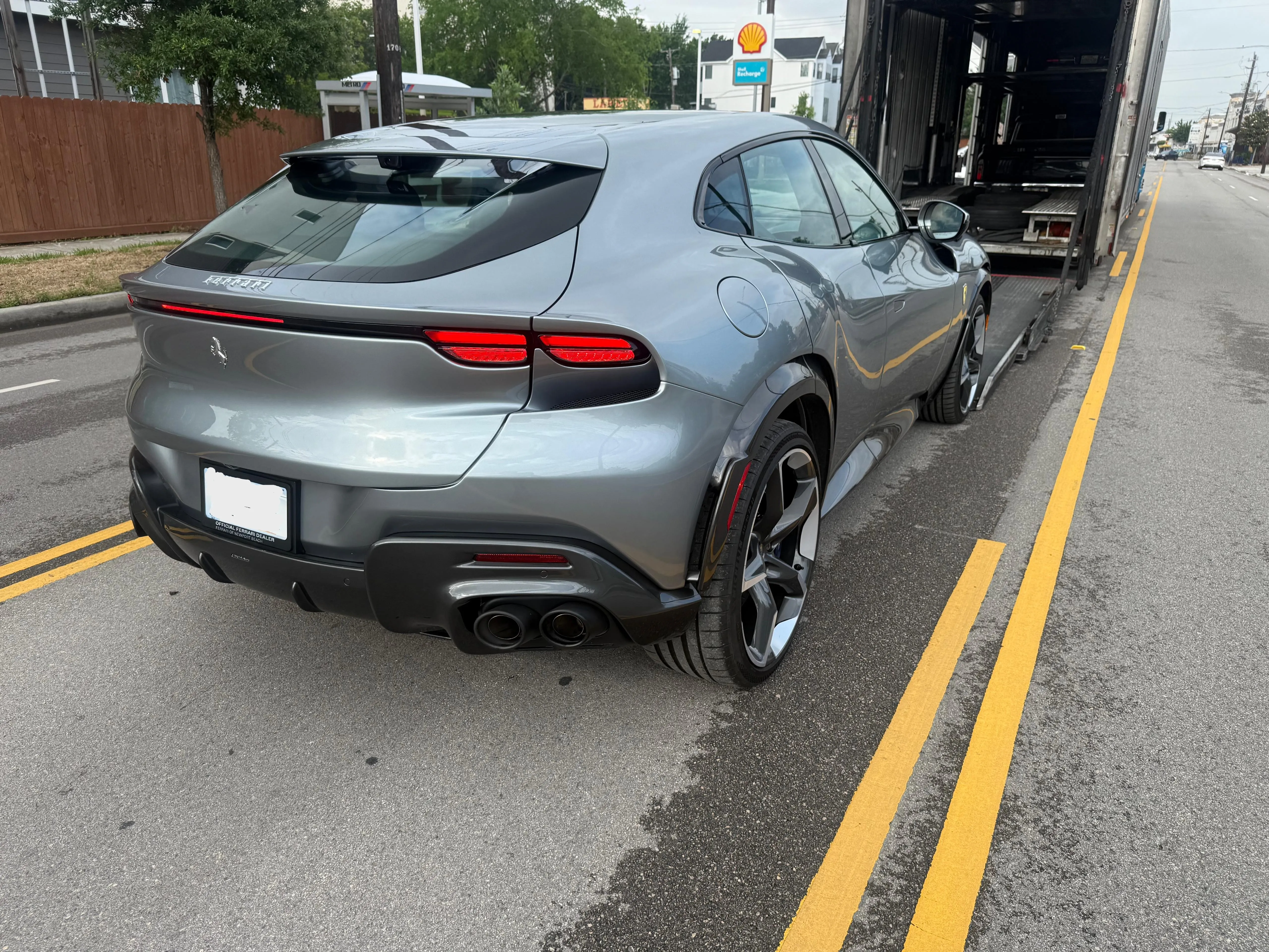 Ferrari Purosangue delivered behind open transporter